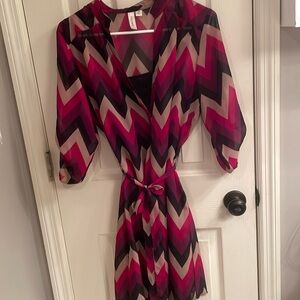 Sheer black, reds, and tan dress with attached black slip under